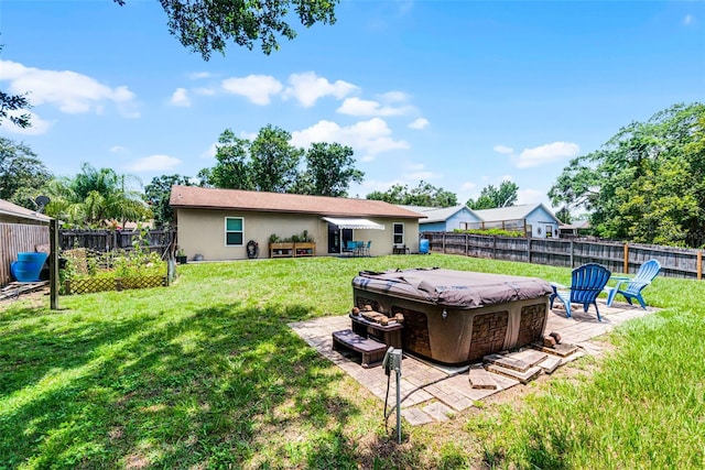 891 Licaria Dr, Ocoee, FL 34761 - fenced backyard featuring a hot tub and a patio
