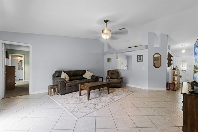 891 Licaria Dr, Ocoee, FL 34761 - living room with light tile patterned flooring, a ceiling fan, and vaulted ceiling