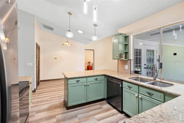 6906 Sawmill Blvd, Ocoee, FL 34761 - kitchen with dishwasher, a sink, green cabinetry, a peninsula, and vaulted ceiling