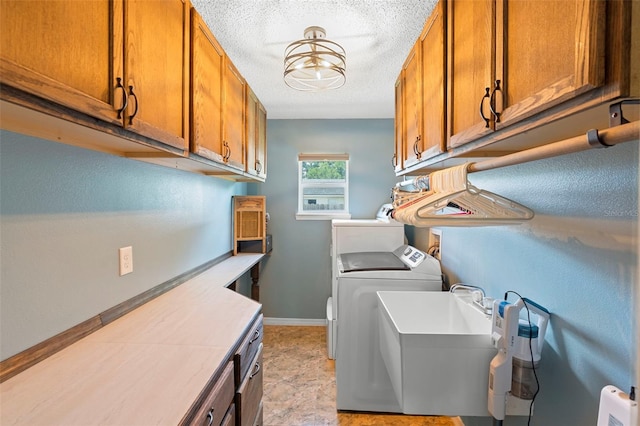 6906 Sawmill Blvd, Ocoee, FL 34761 - laundry room with cabinet space, a textured ceiling, independent washer and dryer, and baseboards