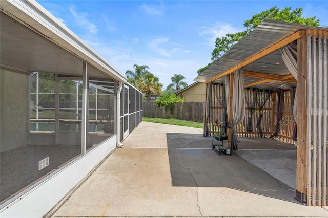 6906 Sawmill Blvd, Ocoee, FL 34761 - fenced backyard featuring a patio and glass enclosure