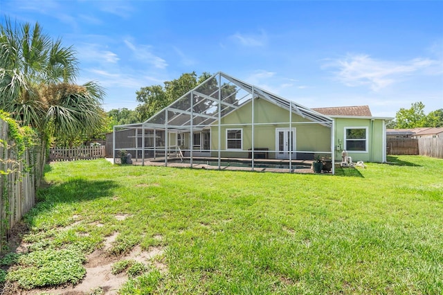 6906 Sawmill Blvd, Ocoee, FL 34761 - rear view of house with glass enclosure