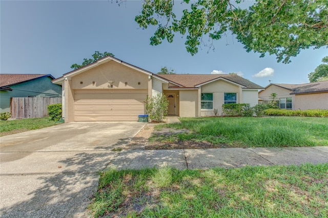 324 Sir Lawrence Dr, Sanford, FL 32773 - view of front of property with an attached garage, driveway, and stucco siding
