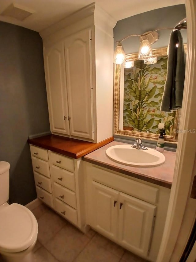 400 E Colonial Dr Unit 910, Orlando, FL 32803 - bathroom with vanity, toilet, and tile patterned floors