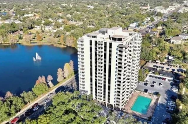 400 E Colonial Dr Unit 910, Orlando, FL 32803 - bird's eye view of a pool area, a nearby body of water, and apartment complex
