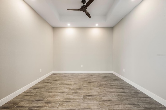 1740 Standing Rock Cir, Oakland, FL 34787 - empty room with ceiling fan, recessed lighting, wood finished floors, and a tray ceiling