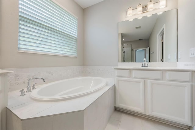 1740 Standing Rock Cir, Oakland, FL 34787 - full bath featuring vanity, a garden tub, a shower stall, and tile patterned floors