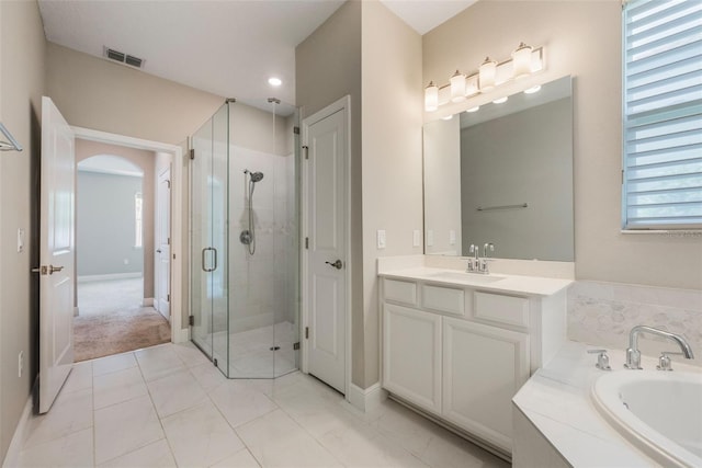 1740 Standing Rock Cir, Oakland, FL 34787 - bathroom with a shower stall, a garden tub, healthy amount of natural light, vanity, and recessed lighting