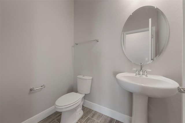 1740 Standing Rock Cir, Oakland, FL 34787 - half bath featuring toilet and wood finished floors