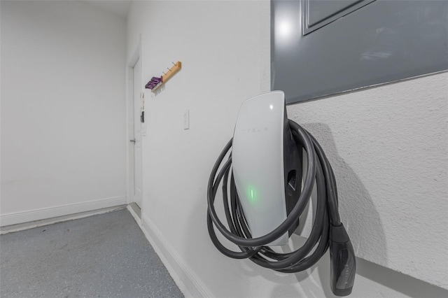 1740 Standing Rock Cir, Oakland, FL 34787 - garage view of car charger and baseboards