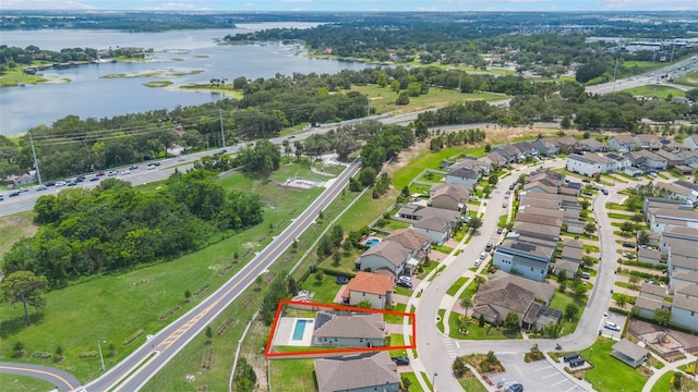 1740 Standing Rock Cir, Oakland, FL 34787 - aerial view of property and surrounding area with property boundaries highlighted, a large body of water, and nearby suburban area