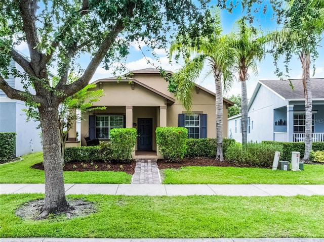 15647 Braintree Ln, Winter Garden, FL 34787 - view of front of house featuring stucco siding and a front lawn