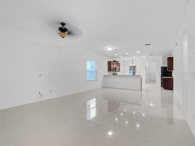 15647 Braintree Ln, Winter Garden, FL 34787 - unfurnished living room with light tile patterned flooring, a ceiling fan, and recessed lighting
