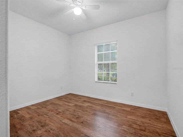 15647 Braintree Ln, Winter Garden, FL 34787 - empty room featuring wood finished floors and a ceiling fan