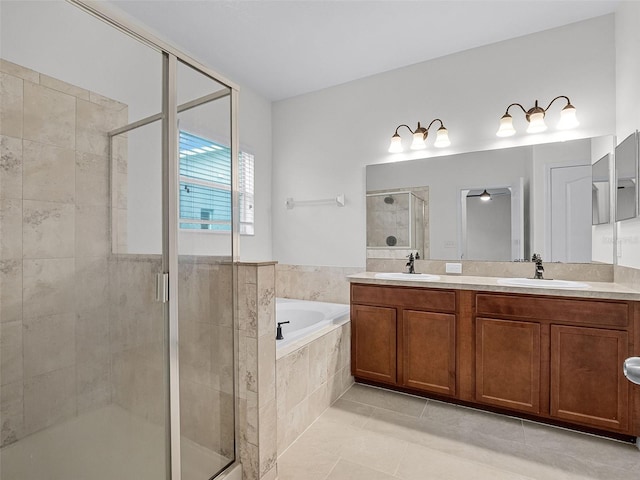 15647 Braintree Ln, Winter Garden, FL 34787 - full bath featuring a shower stall, a bath, double vanity, tile patterned floors, and a ceiling fan