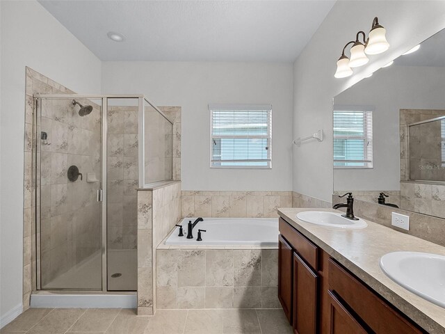 15647 Braintree Ln, Winter Garden, FL 34787 - bathroom with plenty of natural light, a garden tub, and a stall shower