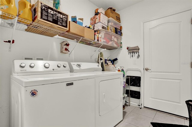 804 Glen Creek Ct, Fruitland Park, FL 34731 - laundry area featuring washer and dryer and light tile patterned floors