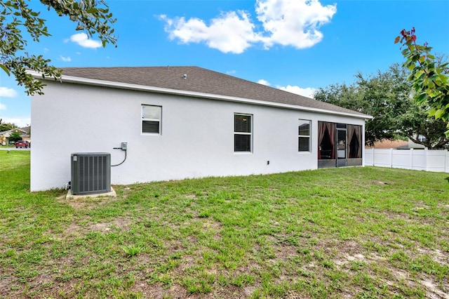 804 Glen Creek Ct, Fruitland Park, FL 34731 - back of property with central air condition unit, a sunroom, and stucco siding