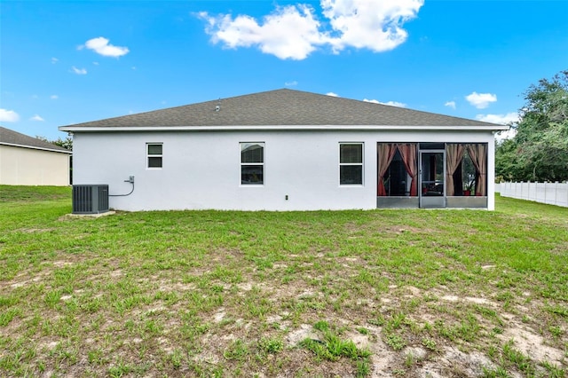 804 Glen Creek Ct, Fruitland Park, FL 34731 - rear view of house featuring a sunroom, stucco siding, and central AC unit