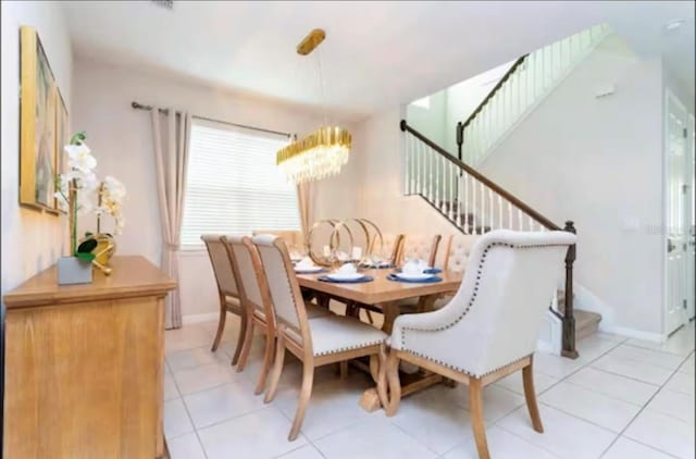 1625 Nassau Point Trl, Kissimmee, FL 34747 - dining room featuring a chandelier, stairway, light tile patterned floors, and baseboards