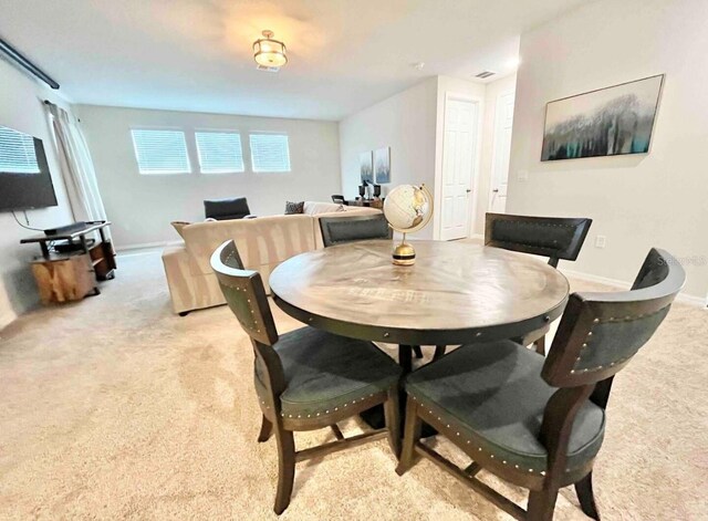 1625 Nassau Point Trl, Kissimmee, FL 34747 - dining space with light carpet and baseboards