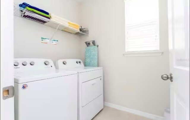 1625 Nassau Point Trl, Kissimmee, FL 34747 - laundry area featuring washer and dryer and baseboards