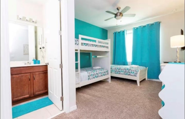 1625 Nassau Point Trl, Kissimmee, FL 34747 - carpeted bedroom with connected bathroom, a ceiling fan, and a sink