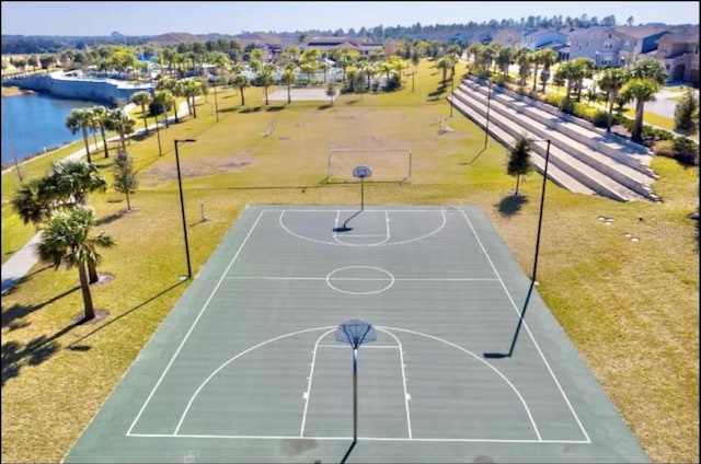 1625 Nassau Point Trl, Kissimmee, FL 34747 - view of sport court with community basketball court, a water view, a residential view, and a lawn