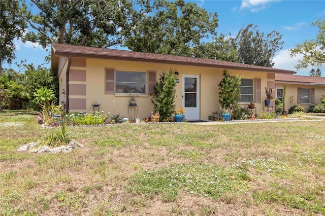 4549 Tippecanoe Trl Unit 20, Sarasota, FL 34233 - single story home with stucco siding and a front lawn