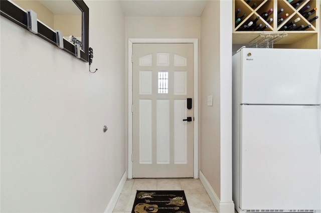 4549 Tippecanoe Trl Unit 20, Sarasota, FL 34233 - doorway featuring baseboards and light tile patterned flooring