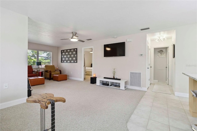 4549 Tippecanoe Trl Unit 20, Sarasota, FL 34233 - living area featuring ceiling fan, baseboards, light carpet, and light tile patterned flooring