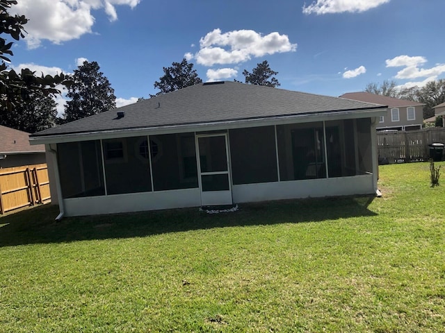 2555 Palmetto Ridge Cir, Apopka, FL 32712 - rear view of property with a sunroom and roof with shingles