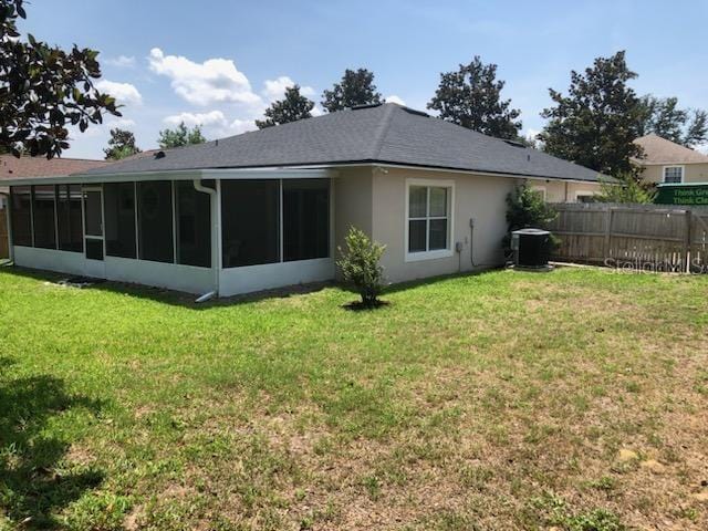 2555 Palmetto Ridge Cir, Apopka, FL 32712 - back of house featuring a sunroom, cooling unit, and stucco siding
