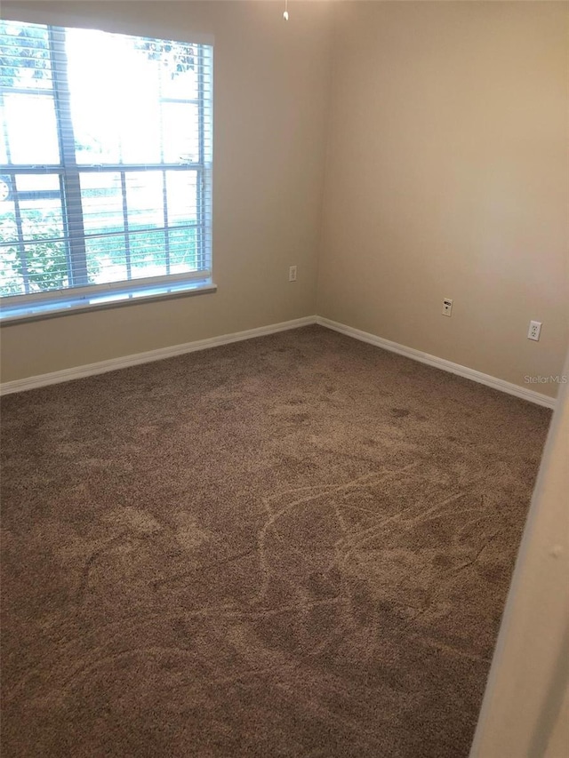 2555 Palmetto Ridge Cir, Apopka, FL 32712 - empty room featuring carpet and baseboards