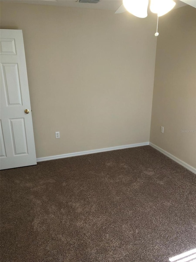 2555 Palmetto Ridge Cir, Apopka, FL 32712 - unfurnished room featuring dark carpet, baseboards, and ceiling fan