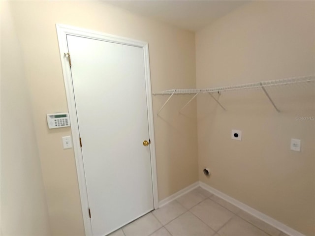 2555 Palmetto Ridge Cir, Apopka, FL 32712 - laundry area with hookup for an electric dryer and light tile patterned floors