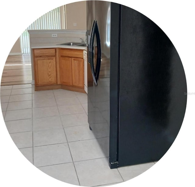 2555 Palmetto Ridge Cir, Apopka, FL 32712 - kitchen with freestanding refrigerator, light countertops, and light tile patterned flooring