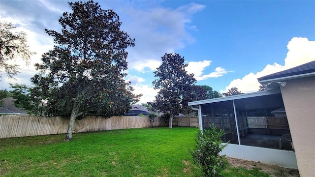 2555 Palmetto Ridge Cir, Apopka, FL 32712 - fenced backyard with a sunroom
