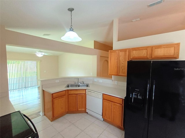 2555 Palmetto Ridge Cir, Apopka, FL 32712 - kitchen with black refrigerator with ice dispenser, white dishwasher, a peninsula, lofted ceiling, and light tile patterned floors