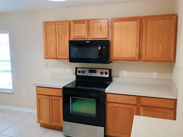 2555 Palmetto Ridge Cir, Apopka, FL 32712 - kitchen featuring black appliances, light countertops, and light tile patterned flooring