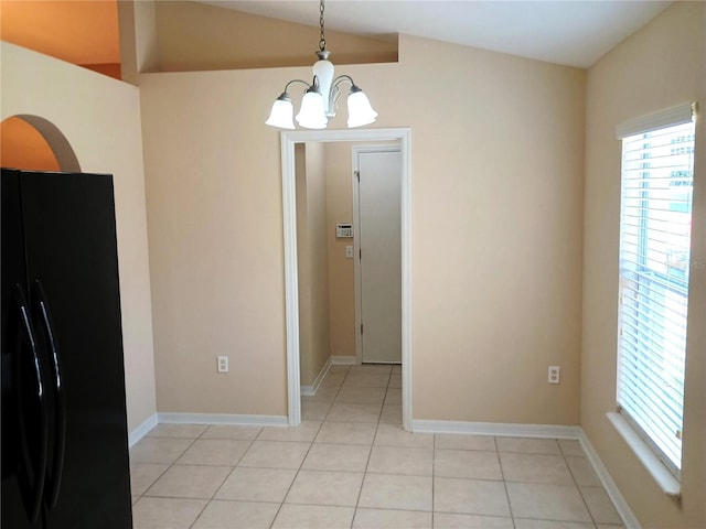 2555 Palmetto Ridge Cir, Apopka, FL 32712 - unfurnished dining area with a chandelier, light tile patterned floors, and lofted ceiling