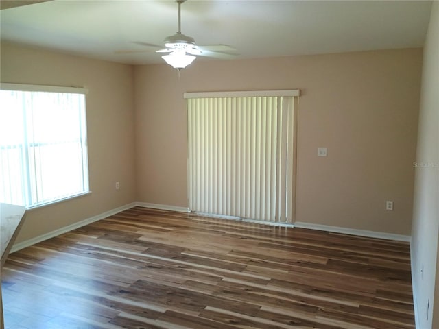 2555 Palmetto Ridge Cir, Apopka, FL 32712 - unfurnished room featuring healthy amount of natural light, wood finished floors, and ceiling fan