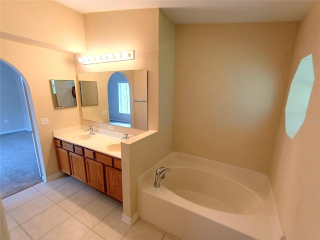 2555 Palmetto Ridge Cir, Apopka, FL 32712 - bathroom featuring double vanity, a garden tub, and tile patterned floors