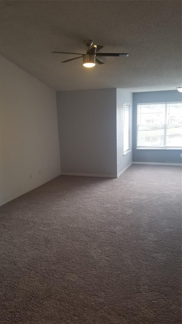 5160 Conroy Rd Unit 1437, Orlando, FL 32811 - empty room featuring carpet flooring, ceiling fan, and a textured ceiling