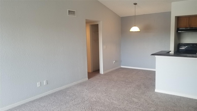 5160 Conroy Rd Unit 1437, Orlando, FL 32811 - kitchen with range, carpet floors, extractor fan, vaulted ceiling, and decorative light fixtures