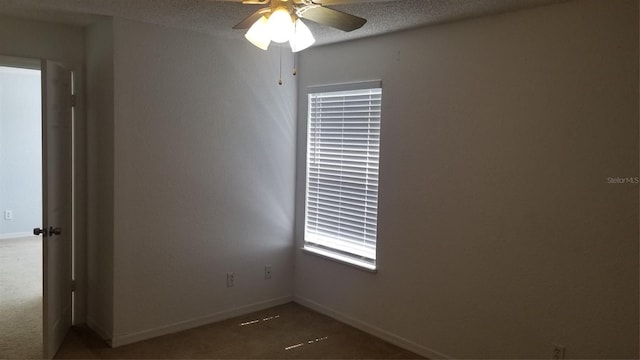 5160 Conroy Rd Unit 1437, Orlando, FL 32811 - unfurnished room with ceiling fan, baseboards, carpet, and a textured ceiling
