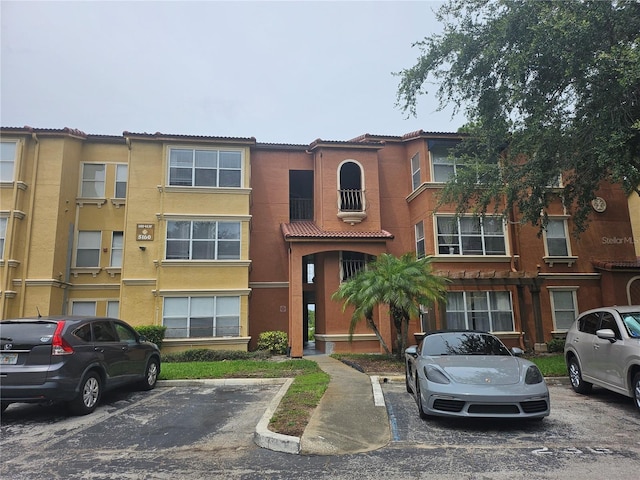 5160 Conroy Rd Unit 1437, Orlando, FL 32811 - view of building exterior featuring uncovered parking