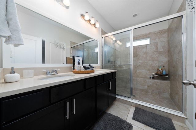 15693 Kinnow Mandarin Ln, Winter Garden, FL 34787 - full bathroom featuring double vanity, a shower stall, and tile patterned flooring
