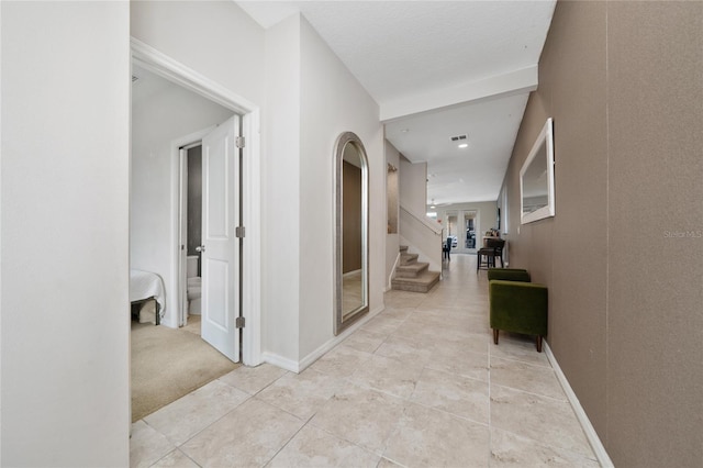 15693 Kinnow Mandarin Ln, Winter Garden, FL 34787 - corridor with stairs, light tile patterned floors, and baseboards