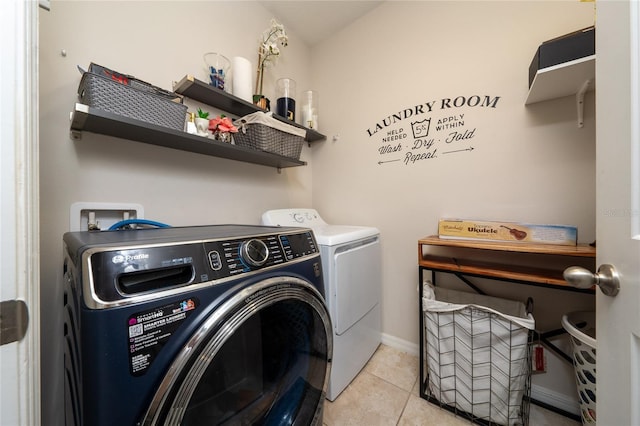 15693 Kinnow Mandarin Ln, Winter Garden, FL 34787 - laundry area with washer and dryer, baseboards, and light tile patterned floors